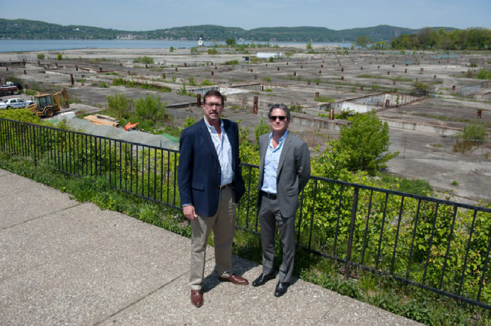From left, Peter Johnson and Jonathan D. Stein, both developers with the Edge-on-Hudson project, standing in front of what remains of a former General Motors operation where the mixed-use building will rise. Credit Bryan Thomas for The New York Times